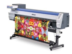 Large format printer producing vibrant floral and butterfly graphics, showcasing capabilities for high-quality banner printing and promotional materials.